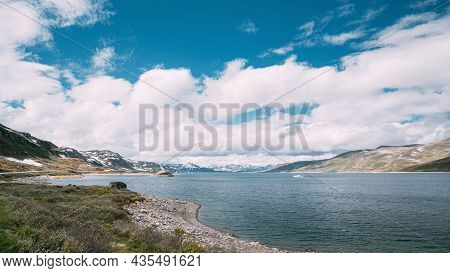 Oppland, Tyin Lake, Norway. Stones On Coast Of Beautiful Lake Tyin In Summer Day. Norwegian Nature. 