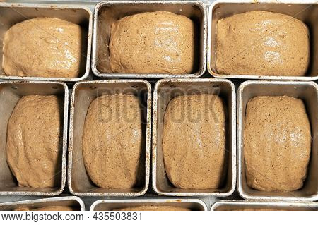 Uncooked Bread In The Form Of Dough Is Placed In Bread Tins Before Baking. Craft Bread. Kravtovoe Pr