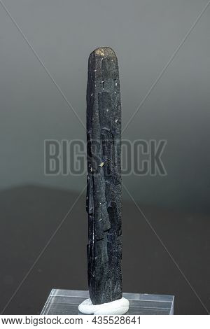 Macro Mineral Stone Ilvaite On A Gray Background Close-up
