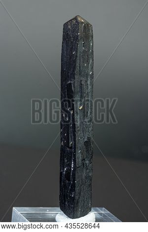 Macro Mineral Stone Ilvaite On A Gray Background Close-up