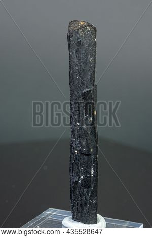 Macro Mineral Stone Ilvaite On A Gray Background Close-up