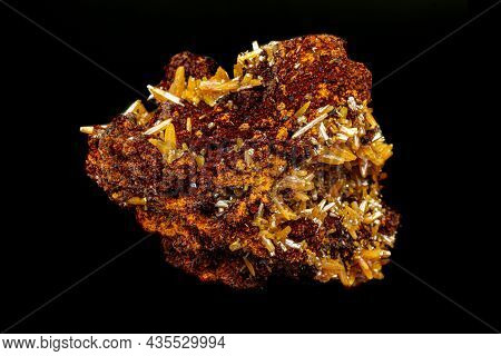 Macro Mineral Wulfenite Stone On A Black Background Close-up