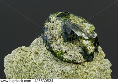 Macro Mineral Stone Andradite On A Black Background Close-up