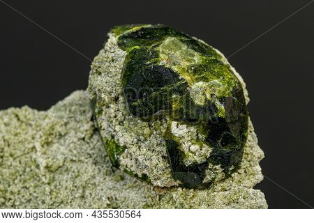 Macro Mineral Stone Andradite On A Black Background Close-up