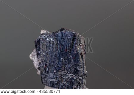 Macro Mineral Acanthite Stone On A Black Background Close-up