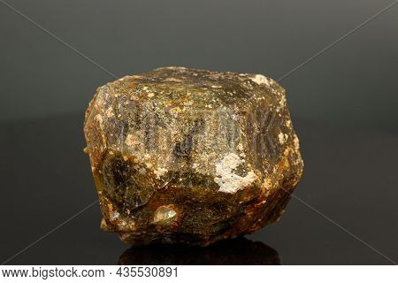 Macro Mineral Stone Andradite On A Black Background Close-up