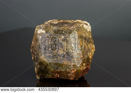 Macro Mineral Stone Andradite On A Black Background Close-up
