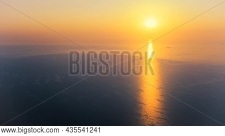 Sunrise Over Calm Sea. Dawn Over Horizon, Ocean, Water - Timelapse Or Hyperlapse. Solar Path On Wate