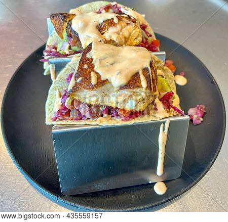 Salmon Tacos With Salsa On A Taco Tray