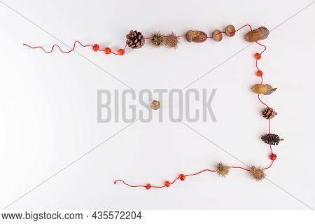 Crafts On The Theme Of Autumn From Natural Material, Easy Acorn Necklace For Kids, Top View White Ba