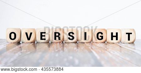 Text Oversight On Wooden Block, Concept Business