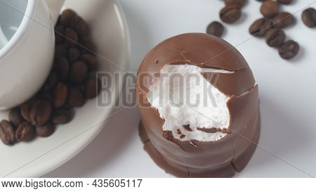 White Chocolate Krembo On The Table. A Chocolate-coated Marshmallow Treat That Is Popular In Israel.