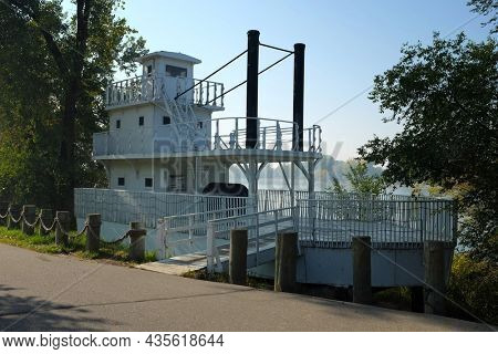BISMARCK, NORTH DAKOTA - 3 OCT 2021: Steamboat Park along the Missouri River features trails and a replica Steamboat .