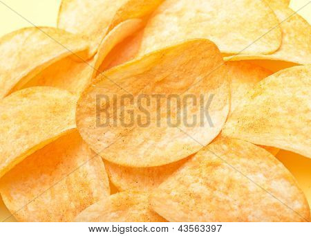 golden fresh potato chips as beautiful background