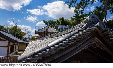 Beautiful Rooftop House At Traditional Garden Under Green Trees. Roof Of Japan