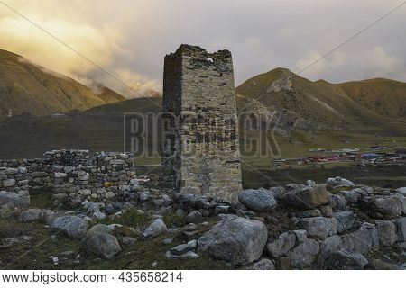 Ancient Ossetian Defensive Tower (tsalikov Tower) On A September Evening. The Outskirts Of The Villa