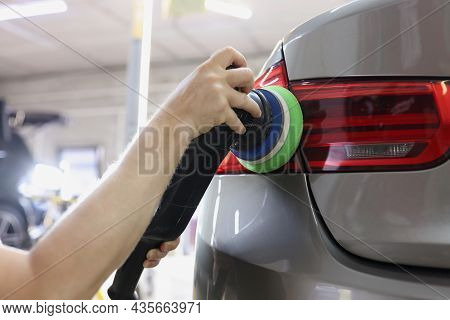 Polishing Rear Lights Of Car From Scratches And Scuffs Closeup