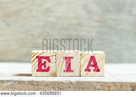 Alphabet Letter Block In Word Eia (abbreviation Of Environmental Impact Assessment) On Wood Backgrou