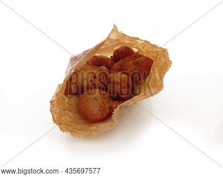Traditional Cod Fritters From The French West Indies In A Freshly Bought Paper Bag. Food And Nutriti