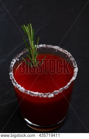 Close-up Tomato Juice With Celery, Spices, Salt And Ice In Glass With Copy Space. Bloody Mary Cockta