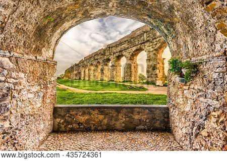 Scenic Rock Arch Balcony Overlooking The Iconic Ruins Of Parco Degli Acquedotti, Rome, Italy