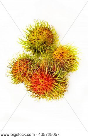 Rambutan Tropical Fruits Of Thailand Lie On A White Background