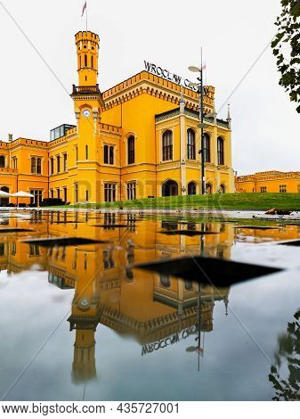 Wroclaw, Poland - September 25 2020: Old Building Of Main Railway Station Reflected In Small Puddle
