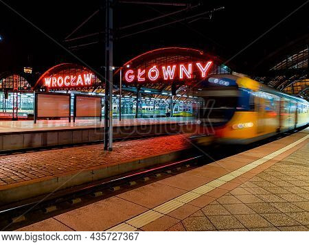 Wroclaw, Poland - September 12 2020: Fast Train Ride Out Of Main Railway Station At Night