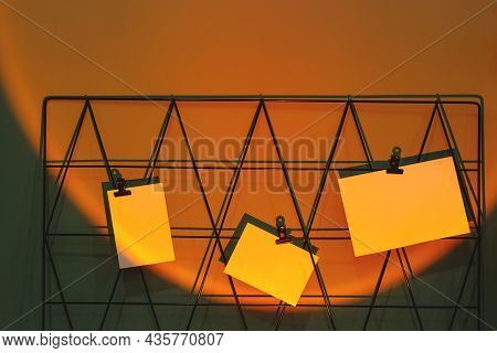 Cards Mockups On Moodboard With Reminders At Freelance Workplace In Sunset Lamp Projection.
