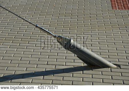 White Tarpaulin Taut, Shading From The Sun And Rain Over The Terrace Of The Restaurant, On The Playg