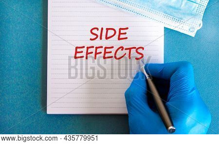 Side Effects Symbol. White Note With Words Side Effects, Beautiful Blue Background, Doctor Hand And 