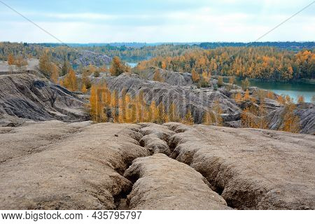 Cracks On The Soil Surface After Mining Brown Coal. Picturesque Autumn Landscape. Conduki. Romantsev