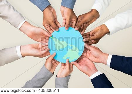 Hands holding earth CSR business campaign