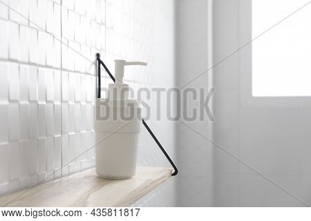 Hand Sanitizer And Face Masks On A Shelf In Bathroom. Coronavirus Covid-19 Hand Hygiene Prevention.