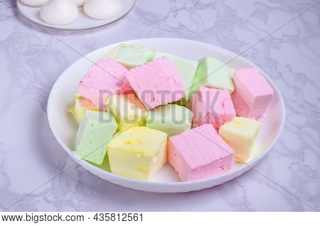 Dessert Multicolored Souffle Marshmallow On A White Plate On A Marble Background