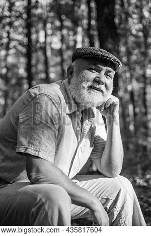 His New Life As Pensioner. Old Pensioner Relax In Natue. Pensioner With Grey Beard Hair In Woods. Be