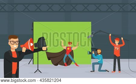 Man In Superhero Costume Against Green Backdrop At Studio With Cameraman Filming At Show Programme O
