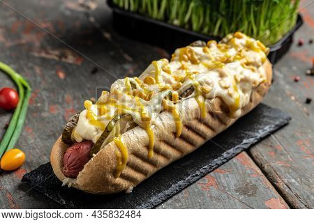 Delicious Grilled Hotdog In A Restaurant, Homemade Sausage Wrapped Hot Dogs With Cheese And Corn. Ba