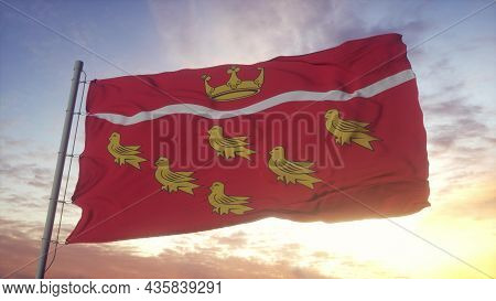 East Sussex Flag, England, Waving In The Wind, Sky And Sun Background. 3d Rendering