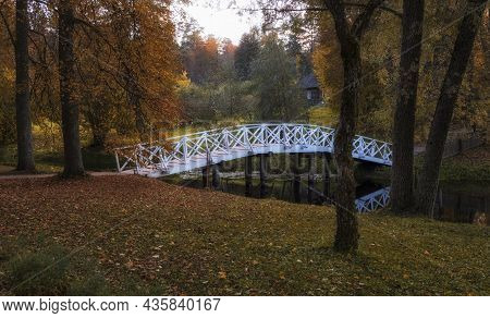 White Bridge In The Pushkin Hills On An Autumn Evening In The Countryside.  Russia