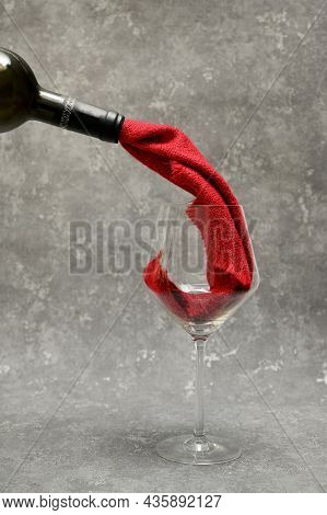 Abstract Red Wine From Cloth Pouring Into A Glass From Bottle