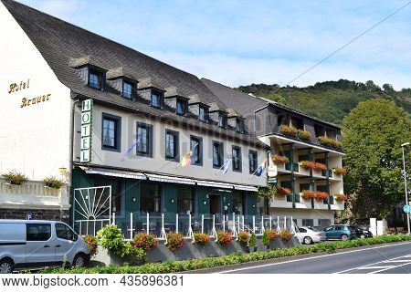 Treis-karden, Germany - 09 21 2021: Waterfront Of Kaden With A Beautiful Hotel With Flowers