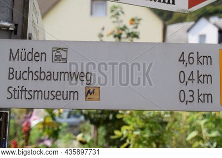 Treis-karden, Germany - 09 21 2021: Way Sign To Müden, Buchsbaumweg And Stiftsmuseum