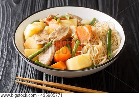 Delicious Homemade Japanese Cuisine Nikujaga Meat And Potatoes Stew Close Up In Bowl On The Wooden T