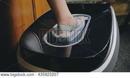 Automatic Thermal Shrinkable Shoe Cover Laminating Machine. Close Up. Machine Automatically Applies 