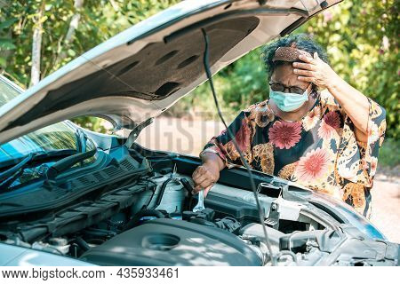 An Old Woman Standing At A Broken Car Trying To Fix The Car Senior Woman The Car Is Broken Road And 
