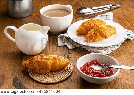 Breakfast With Deicious Homemade Croissants, Strawberry Jam And Hot Milk Coffee. Freshly Baked Crois