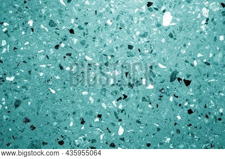 Cement Plate With Small Gravel Stones In Cyan Tone. Abstract Background And Texture For Design.