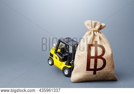 Forklift Unable To Lift A Thai Baht Money Bag. Financial Assistance. High Incomes And Super Profits.