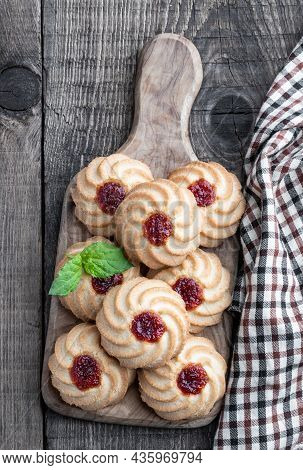 Qurabiya  Cookie Shortbread With Jam On Rustic Wooden Table